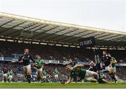 4 February 2017; Keith Earls of Ireland goes over to score his side's first try despite the tackle of Finn Russell of Scotland during the RBS Six Nations Rugby Championship match between Scotland and Ireland at BT Murrayfield Stadium in Edinburgh, Scotland. Photo by Ramsey Cardy/Sportsfile