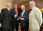 30 June 2011; At the launch of the Irish Sports Monitor report for 2009 are, from left, Chief Executive of the Irish Sports Council John Treacy, ESRI Economist Dr. Pete Lunn,  Michael Ring T.D., Minister of State at the Department of Transport, Tourism and Sport, and Chairman of the Irish Sports Council Kieran Mulvey. Launch of Irish Sports Monitor report for 2009, Davenport Hotel, Merrion Square, Dublin. Picture credit: Barry Cregg / SPORTSFILE