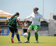 30 June 2011; Team Ireland's Emma Finneran, Ballinasloe, Co. Galway, in action against Iro Apostolidou, Greece,  during a 5-A-Side qualifying game against Greece, which Ireland lost 1-0, at the Hellinikon Olympic Hockey Venue, Hellinikon Olympic Complex, Athens, Greece. 2011 Special Olympics World Summer Games, Athens, Greece. Picture credit: Ray McManus / SPORTSFILE