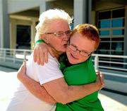 30 June 2011; The youngest Team Ireland athlete, twelve year old Fergal Gregory, Crossmaglen, Co. Armagh, celebrates with his granmother Pauline Byrne, from Newry, Co. Down, after winning a Gold medal in a 25M Butterfly Final in the OAKA Olympic Aquatic Center, Athens Olympic Sport Complex, Athens, Greece. 2011 Special Olympics World Summer Games, Athens, Greece. Picture credit: Ray McManus / SPORTSFILE ***