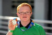 30 June 2011; The youngest Team Ireland athlete, twelve year old Fergal Gregory, Crossmaglen, Co. Armagh, celebrates winning a Gold medal in a 25M Butterfly Final in the OAKA Olympic Aquatic Center, Athens Olympic Sport Complex, Athens, Greece. 2011 Special Olympics World Summer Games, Athens, Greece. Picture credit: Ray McManus / SPORTSFILE
