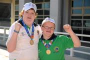 30 June 2011; Lorraine O'Halloran, Palmerstown, Dublin, who won a Gold medal in a 100M Freestyle Final on Tuseday celebrates with the youngest Team Ireland athlete, twelve year old Fergal Gregory, Crossmaglen, Co. Armagh, who won a Gold medal in a 25M Butterfly Final in the OAKA Olympic Aquatic Center, Athens Olympic Sport Complex, Athens, Greece. 2011 Special Olympics World Summer Games, Athens, Greece. Picture credit: Ray McManus / SPORTSFILE