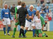 2 July 2011; Paul McGrath, Republic of Ireland XI, and Mick Cooke, League of Ireland Managers Selection, remonstrate with referee Pat Kelly during the game. Italia 90 World Cup Reunion Match, Republic of Ireland XI v League of Ireland Managers Selection, Hunky Dory Park, Drogheda, Co. Louth. Photo by Sportsfile