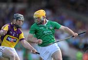 2 July 2011; James Ryan, Limerick, in action against Darren Stamp, Wexford. GAA Hurling All-Ireland Senior Championship, Phase 2, Limerick v Wexford, Gaelic Grounds, Limerick. Picture credit: Matt Browne / SPORTSFILE