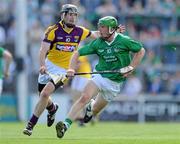 2 July 2011; Niall Moran, Limerick, in action against PJ Nolan, Wexford. GAA Hurling All-Ireland Senior Championship, Phase 2, Limerick v Wexford, Gaelic Grounds, Limerick. Picture credit: Matt Browne / SPORTSFILE