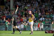 2 July 2011; Paul Roche, Wexford, is sent off by referee Michael Wadding. GAA Hurling All-Ireland Senior Championship, Phase 2, Limerick v Wexford, Gaelic Grounds, Limerick. Picture credit: Matt Browne / SPORTSFILE