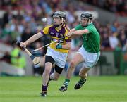 2 July 2011; PJ Nolan, Wexford, in action against Donal O'Grady, Limerick. GAA Hurling All-Ireland Senior Championship, Phase 2, Limerick v Wexford, Gaelic Grounds, Limerick. Picture credit: Matt Browne / SPORTSFILE