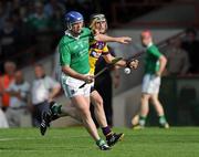 2 July 2011; Brian Geary, Limerick, in action against PJ Nolan, Wexford. GAA Hurling All-Ireland Senior Championship, Phase 2, Limerick v Wexford, Gaelic Grounds, Limerick. Picture credit: Matt Browne / SPORTSFILE