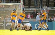 2 July 2011; Joe Canning, Galway, lies on the ground after being fouled by James McInerney, Clare, right, resulting in a red card for McInerney. GAA Hurling All-Ireland Senior Championship, Phase 2, Galway v Clare, Pearse Stadium, Galway. Picture credit: Stephen McCarthy / SPORTSFILE