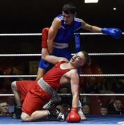 4 February 2017; Tiernan Bradley of Sacred Heart is knocked down by Gerard French of Clonard U during their 69kg bout during the 2016 IABA Elite Boxing Championships at the National Stadium in Dublin. Photo by Cody Glenn/Sportsfile