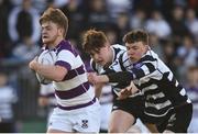 5 February 2017; Barry Dooley of Clongowes Wood College evades the tackles of Conor Power and Dylan Keane of Cistercian College Roscrea on his way to scoring a first half try during the Bank of Ireland Leinster Schools Junior Cup Round 1 match between Cistercian College Roscrea and Clongowes Wood College at Donnybrook Stadium in Donnybrook, Dublin. Photo by Cody Glenn/Sportsfile