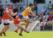 3 July 2011; Paddy Doherty, Antrim, in action against J.J. Hughes, left, and Ciaran Clifford, Armagh. Ulster GAA Hurling Senior Championship Final, Antrim v Armagh, Casement Park, Belfast, Co. Antrim. Picture credit: Pat Murphy / SPORTSFILE