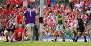 3 July 2011; Kieran Donaghy, Kerry, is shown a yellow card by referee David Coldrick as Noel O'leary, 5, Cork, receives attention. Munster GAA Football Senior Championship Final, Kerry v Cork, Fitzgerald Stadium, Killarney, Co. Kerry. Picture credit: Brendan Moran / SPORTSFILE