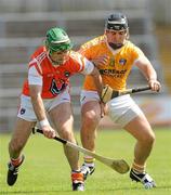 3 July 2011; Ruairi McGrattan, Armagh, in action against Paddy Doherty, Antrim. Ulster GAA Hurling Senior Championship Final, Antrim v Armagh, Casement Park, Belfast, Co. Antrim. Picture credit: Pat Murphy / SPORTSFILE