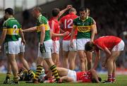 3 July 2011; Ciaran Sheehan, Cork, lies injured before leaving the pitch on a stretcher, during the second half. Munster GAA Football Senior Championship Final, Kerry v Cork, Fitzgerald Stadium, Killarney, Co. Kerry. Picture credit: Stephen McCarthy / SPORTSFILE