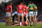 3 July 2011; Ciaran Sheehan, Cork, is attended to by Dr. Con Murphy before leaving the pitch on a stretcher, during the second half. Munster GAA Football Senior Championship Final, Kerry v Cork, Fitzgerald Stadium, Killarney, Co. Kerry. Picture credit: Stephen McCarthy / SPORTSFILE