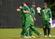5 July 2011; John Mooney, Ireland, congratulates bowler George Dockrell, left, after he stumped out Pikkie Ya France, Namibia. One Day International, Ireland v Namibia, Stormont, Belfast, Co. Antrim. Photo by Sportsfile
