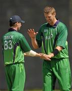 5 July 2011; Boyd Rankin, right, Ireland, is congratulated by team-mate Alex Cusack, after Louis van der Westhuizen, Namibia, was caught and bowled out by his delivery. One Day International, Ireland v Namibia, Stormont, Belfast, Co. Antrim. Photo by Sportsfile