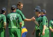 5 July 2011; Boyd Rankin, 3rd from left, Ireland, is congratulated by team-mates after Louis van der Westhuizen, Namibia, was caught and bowled out by his delivery. One Day International, Ireland v Namibia, Stormont, Belfast, Co. Antrim. Photo by Sportsfile