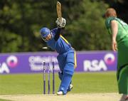 5 July 2011; Ireland bowler Kevin O'Brien makes a delivery to stump out Gerhard Rudolph, Namibia. One Day International, Ireland v Namibia, Stormont, Belfast, Co. Antrim. Photo by Sportsfile