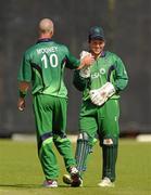 5 July 2011; Ireland wicket-keeper Gary Wilson, right, celebrates with team-mate John Mooney, after Namibia batsman Christi Viljoen was caught behind by Wilson, to leave Namibia all out with 176 after 36 overs. One Day International, Ireland v Namibia, Stormont, Belfast, Co. Antrim. Photo by Sportsfile
