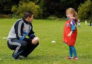 7 July 2011; Madison Stamper, age 6, from North Strand, chatting to Dublin hurler Alan Nolan during a GAA VHI Cúl Camp in Clonliffe College, Dublin. The camps, sponsored and subsidised by Croke Park and the GAA, catered for more than 150 local children from the Croke Park locality under the direction of camp co-ordinator Liam Ryan this week. Clonliffe College, Clonliffe Road, Dublin. Picture credit: Brendan Moran / SPORTSFILE
