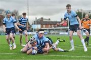 7 February 2017; Ciaran McCarrick of Castleknock College scores his side's first try despite the tackle of Jack Boyle of St Michael’s College during the Bank of Ireland Leinster Schools Junior Cup Round 1 match between St Michael’s College and Castleknock College at Donnybrook Stadium in Dublin. Photo by Ramsey Cardy/Sportsfile