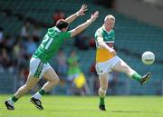 9 July 2011; Niall Darby, Offaly, in action against John Mullane, Limerick. GAA Football All-Ireland Senior Championship Qualifier Round 2, Limerick v Offaly, Gaelic Grounds, Limerick. Picture credit: Stephen McCarthy / SPORTSFILE