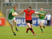 9 July 2011; Brian McDonald, Leitrim, in action against Kevin Duffin, Down. GAA Football All-Ireland Senior Championship Qualifier Round 2, Down v Leitrim, Pairc Esler, Newry, Co. Down. Picture credit: Oliver McVeigh / SPORTSFILE