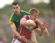 9 July 2011; Fiachra  Breathnach, Galway, in action against Paddy O'Rourke, Meath. GAA Football All-Ireland Senior Championship Qualifier Round 2, Meath v Galway, Pairc Tailteann, Navan, Co. Meath. Photo by Sportsfile