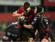 10 February 2017; Jack O'Donoghue of Munster is tackled by Pat Howard and Nic Cudd of Newport Gwent Dragons during the Guinness PRO12 Round 14 match between Munster and Newport Gwent Dragons at Irish Independent Park in Cork. Photo by Diarmuid Greene/Sportsfile