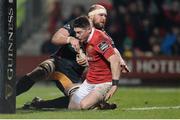10 February 2017; Ronan O'Mahony of Munster scores a try for his side despite the efforts of Rynard Landman during the Guinness PRO12 Round 14 match between Munster and Newport Gwent Dragons at Irish Independent Park in Cork. Photo by Eóin Noonan/Sportsfile