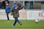 11 February 2017; Six year old St Vincent's supporter Peadar Lambe kicking the ball on the field during half time in the AIB GAA Football All-Ireland Senior Club Championship semi-final match between Slaughtneil and St Vincent's at Páirc Esler in Newry. Photo by Oliver McVeigh/Sportsfile