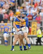 10 July 2011; Shane McGrath, Tipperary, with team-mate Eoin Kelly after he was awarded an early free during the first half. Munster GAA Hurling Senior Championship Final, Waterford v Tipperary, Pairc Ui Chaoimh, Cork. Picture credit: Diarmuid Greene / SPORTSFILE