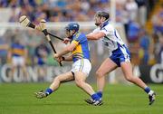 10 July 2011; Eoin Kelly, Tipperary, in action against Tony Browne, Waterford. Munster GAA Hurling Senior Championship Final, Waterford v Tipperary, Pairc Ui Chaoimh, Cork. Picture credit: Stephen McCarthy / SPORTSFILE