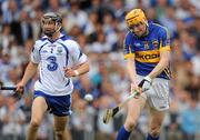 10 July 2011; Lar Corbett, Tipperary, shoots to score his side's third goal, despite the attention of Darragh Fives, Waterford. Munster GAA Hurling Senior Championship Final, Waterford v Tipperary, Pairc Ui Chaoimh, Cork. Picture credit: Stephen McCarthy / SPORTSFILE