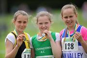 10 July 2011; Zoe Mohan, from Cushinstown A.C., Co. Meath, with the gold medal she won in the Under-12 long Jump, with silver medel winner Ciara Deely, left, from Kilkenny City Harriers, and bronze medal winner Sommer Lecky, right, from Finn Valey A.C., Co. Donegal. Woodie’s DIY Juvenile Track and Field Championships of Ireland, Tullamore Harriers, Tullamore, Co. Offaly. Picture credit: Matt Browne / SPORTSFILE