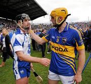 10 July 2011; Shane McGrath, Tipperary, comforts Tony Browne, Waterford, after the game. Munster GAA Hurling Senior Championship Final, Waterford v Tipperary, Pairc Ui Chaoimh, Cork. Picture credit: Ray McManus / SPORTSFILE