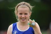 10 July 2011; Molly Scott, from St. Laurence O'Toole Athletic Club, Carlow Town, with the two gold medals she won in the Under-13 Long Jump and 100m Hurdles and the silver medel she won in the 100m. Woodie’s DIY Juvenile Track and Field Championships of Ireland, Tullamore Harriers, Tullamore, Co. Offaly. Picture credit: Matt Browne / SPORTSFILE