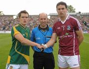 9 July 2011; Meath captain Seamus Kenny shakes hands with Galway captain Finian Hanley alongside referee Michael Collins. GAA Football All-Ireland Senior Championship Qualifier Round 2, Meath v Galway, Pairc Tailteann, Navan, Co. Meath. Photo by Sportsfile
