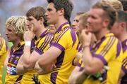 10 July 2011; Dejected Wexford players look on as Dublin receive the cup. Leinster GAA Football Senior Championship Final, Dublin v Wexford, Croke Park, Dublin. Picture credit: Brian Lawless / SPORTSFILE