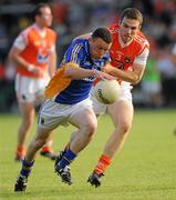 9 July 2011; Leighton Glynn, Wicklow, in action against Brendan Donaghy, Armagh. GAA Football All-Ireland Senior Championship Qualifier Round 2, Armagh v Wicklow, Morgan Athletic Grounds, Armagh. Picture credit: Oliver McVeigh / SPORTSFILE