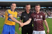 2 July 2011; Clare captain Pat Vaughan, left, and Galway captain Damien Hayes shake hands before the game in the company of referee Diarmuid Kirwan. GAA Hurling All-Ireland Senior Championship, Phase 2, Galway v Clare, Pearse Stadium, Galway. Picture credit: Barry Cregg / SPORTSFILE
