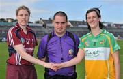 2 July 2011; Galway captain Brenda Hanney and Offaly captain Elaine Dermody shake hands before the game alongside referee Eadhmonn Mac Suibhne. All-Ireland Senior Camogie Championship, Round 4, in association with RTE Sport, Galway v Offaly, Pearse Stadium, Galway. Picture credit: Barry Cregg / SPORTSFILE