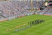 10 July 2011; The Dublin and Wexford teams walk behind the band of An Garda Síochana in front of Hill 16 during the pre-match parade. Leinster GAA Football Senior Championship Final, Dublin v Wexford, Croke Park, Dublin. Picture credit: Brendan Moran / SPORTSFILE