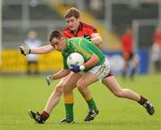 9 July 2011; John McKeon, Leitrim, in action against Conor Maginn, Down. GAA Football All-Ireland Senior Championship Qualifier Round 2, Down v Leitrim, Pairc Esler, Newry, Co. Down. Picture credit: Oliver McVeigh / SPORTSFILE