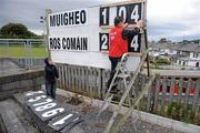 26 June 2011; Padraic Browne, from Castlebar, Co. Mayo, changes the scoreboard watched by his grandson Oisin during the Connacht GAA Football Minor Championship Semi-Final, Mayo v Roscommon, McHale Park, Castlebar, Co. Mayo. Picture credit: Ray Ryan / SPORTSFILE