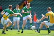 9 July 2011; Stephen Kelly, Limerick, in action against Brian Darby, left, and Alan Mulhall, Offaly. GAA Football All-Ireland Senior Championship Qualifier Round 2, Limerick v Offaly, Gaelic Grounds, Limerick. Picture credit: Diarmuid Greene / SPORTSFILE