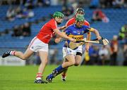15 July 2011; John O'Neill, Tipperary, in action against William Egan, left, and Mark Ellis, right, Cork. Bord Gáis Energy Munster GAA Hurling Under 21 Championship Semi-Final, Tipperary v Cork, Semple Stadium, Thurles, Co. Tipperary. Picture credit: Barry Cregg / SPORTSFILE