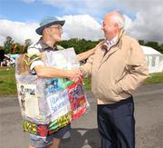 16 July 2011; Brian Tyrrell, left, from Popintree, Dublin, congratulates Frank Greally, Editor of the Irish Runner, on 30 years of publication. The National Lottery Irish Runner 5 Mile, Phoenix Park, Dublin. Picture credit: Tomas Greally / SPORTSFILE